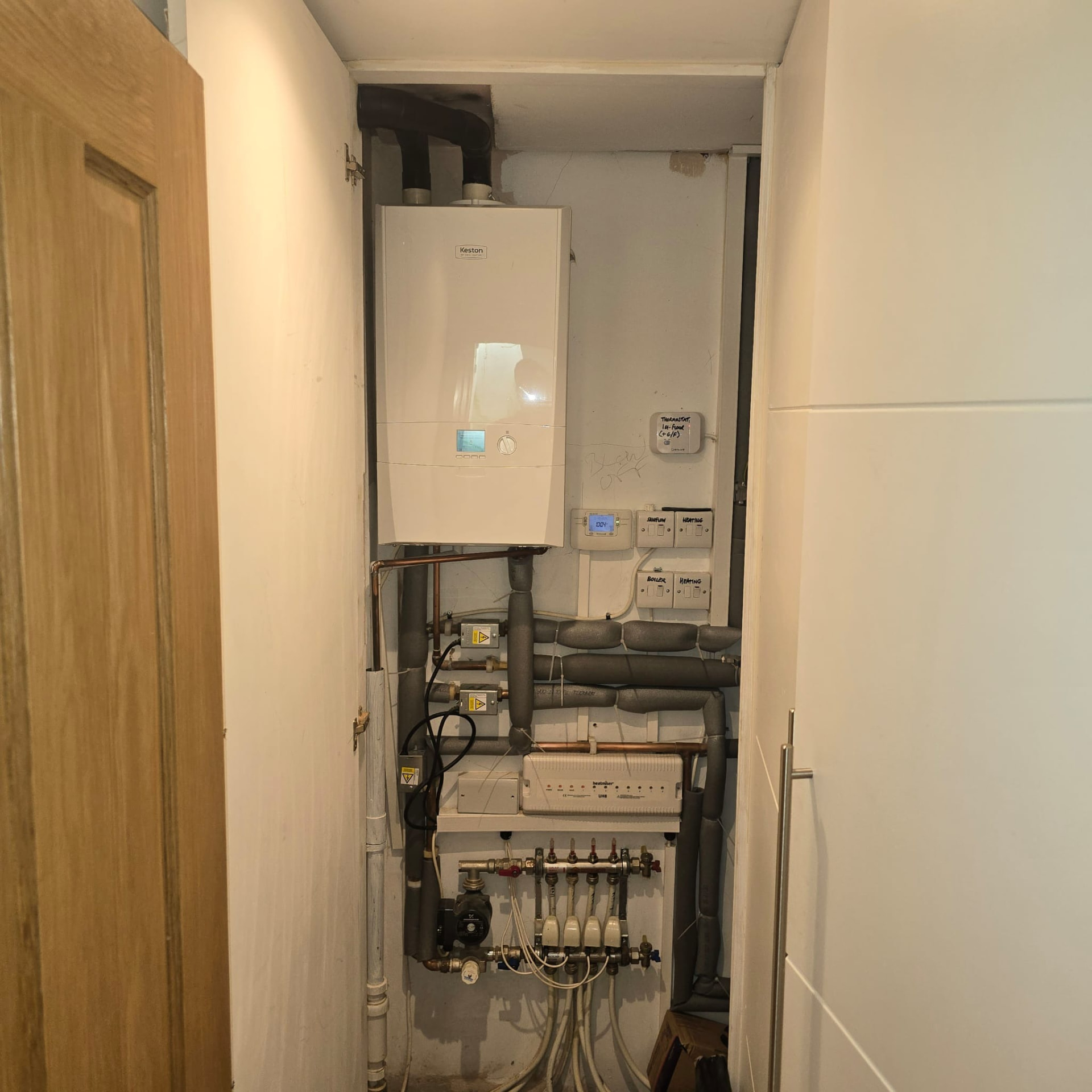 Keston boiler with underfloor heating manifold and pipework after a full central heating installation